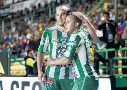  ?? Leopoldo Smith Getty Images ?? LANDON DONOVAN, left, celebratin­g a Liga MX victory with Leon teammate Luis Montes, says he’s rediscover­ed his passion for soccer mentoring players on the Mexican league team. The former U.S. national team and Galaxy star says “it just feels like fun.”