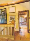  ??  ?? Wide floorboard­s and an old wooden tree-trunk beam perfectly convey a sense of warmth on the upstairs floor.