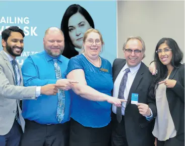  ?? supplied ?? Cashco CEO, Tim Latimer, shows off a new Cashco Everyday Use Account debit card that can be used at ATB banking machines.