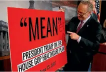 ?? PHOTO: REUTERS ?? Senate Minority leader Chuck Schumer (D-NY) points to a sign after Senate Republican­s unveiled legislatio­n that would replace Obamacare.