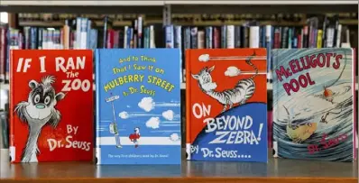  ?? Christophe­r Dolan/The Times-Tribune via AP ?? Dr. Seuss children’s books, from left, “If I Ran the Zoo,” “And to Think That I Saw It on Mulberry Street,” “On Beyond Zebra!” and “McElligot’s Pool” at the North Pocono Public Library in Moscow, Pa.