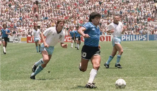  ??  ?? June 22, 1986: Maradona takes on the entire England team in Mexico.