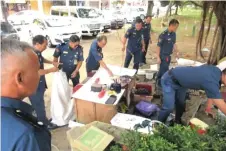  ??  ?? MCC enforcemen­t team clears the vagrants’ belongings during a recent operation at Bintang Commercial Centre bus stop area.