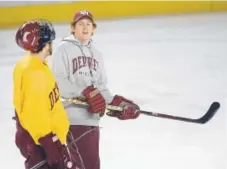  ?? Denver Post file ?? University of Denver assistant hockey coach David Carle, right, turned down a head coaching opportunit­y for a chance to someday lead the Pioneers.