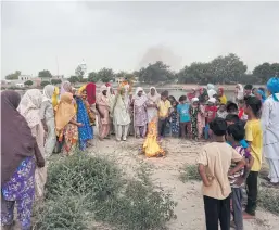  ??  ?? Women of Sirsiwala, India, gather for an ancient ritual believed to force the gods to unleash rain and ease suffering.