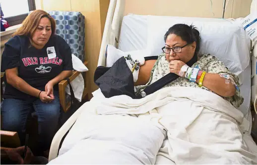  ??  ?? Bautista (right) was shot in the forearm and will require additional surgeries. A total of 59 people were killed and 527 injured in the incident. — Photos: TNS