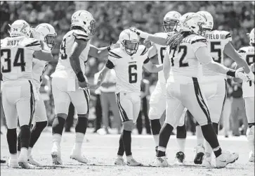  ?? Robert Gauthier Los Angeles Times ?? CHARGERS KICKER Caleb Sturgis earned hand pats from teammates, praise from coach Anthony Lynn.