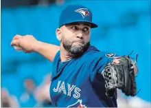  ?? FRED THORNHILL THE CANADIAN PRESS ?? Designated hitter Kendrys Morales pitches against the A’s on Sunday.