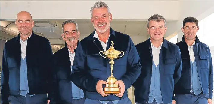  ?? Getty. ?? Paul Lawrie, second right, with captain Darren Clarke, centre, and fellow vice-captains Thomas Bjorn, Sam Torrance and Padraig Harrington at Heathrow Airport yesterday.