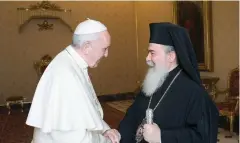  ?? (Courtesy) ?? POPE FRANCIS greets Theophilos III, the Greek patriarch of Jerusalem, at the Vatican yesterday.