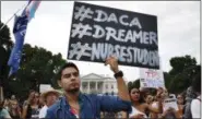  ?? JACQUELYN MARTIN ?? Carlos Esteban, 31, of Woodbridge, Va., a nursing student and recipient of Deferred Action for Childhood Arrivals, known as DACA, rallies with others in support of DACA outside of the White House, in Washington, on Tuesday.