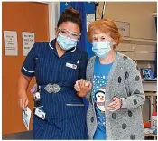 ??  ?? Helping hand: Nurse Parsons with Mrs Keenan