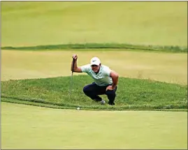  ?? CHARLES KRUPA / AP ?? Brooks Koepka prepares to putt on the fourth hole during the third round of the U.S. Open golf tournament at The Country Club on Saturday in Brookline, Mass.