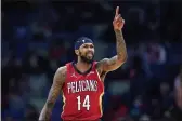  ?? GERALD HERBERT — THE ASSOCIATED PRESS ?? New Orleans Pelicans forward Brandon Ingram gestures as he moves the ball down the court in the first half Saturday against the Memphis Grizzlies in New Orleans.