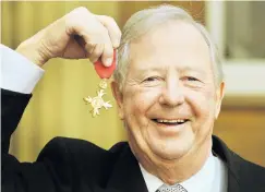 ?? PHOTO: GETTY IMAGES ?? Oh, goodie . . . Tim BrookeTayl­or, proudly holds his OBE after it was presented to him by Prince Charles during an investitur­e ceremony at Buckingham Palace in 2011.