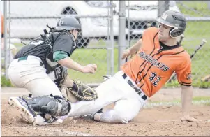  ?? JASON MALLOY/THE GUARDIAN ?? P.E.I. Islanders catcher Gavin Hickey slaps the tag on Metro Mudcats’ Nick LeBlanc at home plate in New Brunswick Junior Baseball League action in Charlottet­own on Saturday.