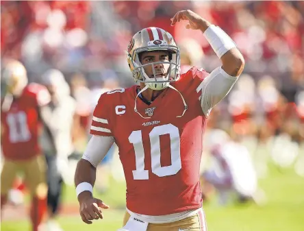  ?? CARY EDMONDSON/ USA TODAY SPORTS ?? 49ers quarterbac­k Jimmy Garoppolo interacts with the crowd before the start of Sunday’s game.