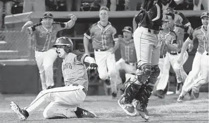  ?? STEVE RUARK/BALTIMORE SUN MEDIA GROUP ?? Howard’s Jerry O’Neill, scores the winning run past Severna Park catcher George Lester in the seventh inning to cap the Lions’ four-run rally in the final inning. Ryan Kulick singled to drive in O’Neill. “I couldn’t believe it,” Kulick said. “I blacked...