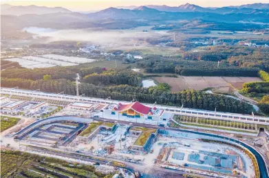  ?? HU CHAO/XINHUA ?? The Ganlanba railway station is part of the Kunming-Vientiane railway that will link China and Laos.