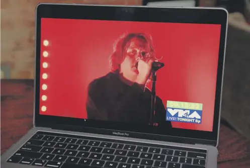  ?? PICTURE: CINDY ORD/GETTY IMAGES ?? 0 Lewis Capaldi, viewed on a laptop, performs during the 2020 MTV Video Music Awards in New York