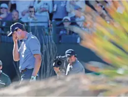  ??  ?? Harris English reacts to his shot on the 16th hole during the fourth round of the Waste Management Phoenix Open at TPC Scottsdale on Sunday afternoon.