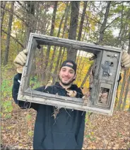  ?? PHOTO PROVIDED ?? A Saratoga PLAN Next Generation Committee member finds and removes trash from the the Saratoga Siege Trail in the Village of Victory.