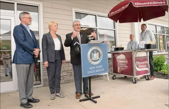  ?? Lori Van Buren / Times Union ?? State Sen. James Tedisco speaks as he and Assemblywo­man Mary Beth Walsh, second from left, formally induct Stewart’s Shops into the state Historic Business Preservati­on Registry on Tuesday. Gary Dake, president of Stewart’s Shops, stands at left.
