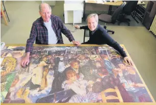  ??  ?? Jim and Michael with the 5,000 piece jigsaw