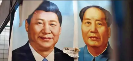  ?? GREG BAKER/AFP ?? Portraits of Chinese President Xi Jinping (left) and late communist leader Mao Zedong at a market in Beijing on September 19.