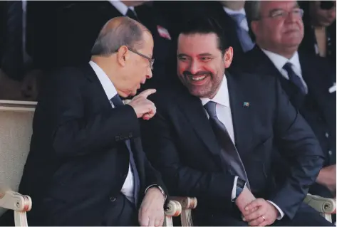  ?? Reuters ?? Lebanese Prime Minister-designate Saad Hariri, right, talks with President Michel Aoun in downtown Beirut in November last year. The country has been without a government since an election almost eight months ago