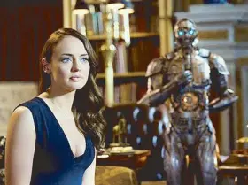  ??  ?? Upstaged by her dress (and the robot butler in the background), Laura Haddock is nonetheles­s a good comic foil to Wahlberg’s failed inventor.
