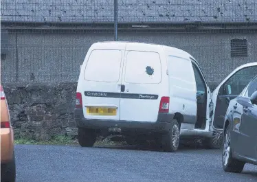  ?? MARTIN McKEOWN ?? The scene at Clooneyvil­le Avenue where a gunman opened fire on a community worker