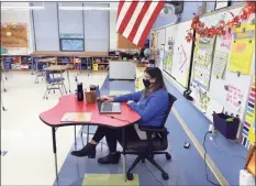  ?? Arnold Gold / Hearst Connecticu­t Media file photo ?? Third grade teacher Alena Roberts prepares an online lesson at Bishop Woods School in New Haven on Oct. 16, 2020.