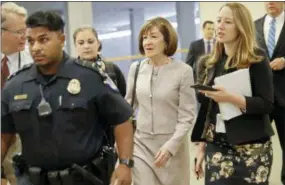  ?? PABLO MARTINEZ MONSIVAIS — THE ASSOCIATED PRESS ?? Sen. Susan Collins, R-Maine, is followed by members of the media as she walks to the Capitol before a vote to advance Brett Kavanaugh’s nomination to the Supreme Court, on Capitol Hill, Friday in Washington.