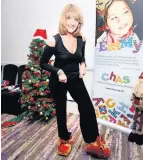  ??  ?? Perfect look Broadcaste­r Kaye Adams knows the festive slippers she’ll be wearing