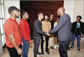  ?? William Vasta For USC Marshall School of Business ?? AMONG THE audience members to meet Bryant at the USC event were Justin Powell, second from left, who said the former Laker had a “profound influence” on him.