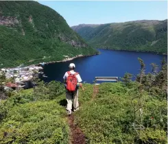  ??  ?? Located on a picturesqu­e fjord, the outport of Grey River features a trail to an impressive overlook.