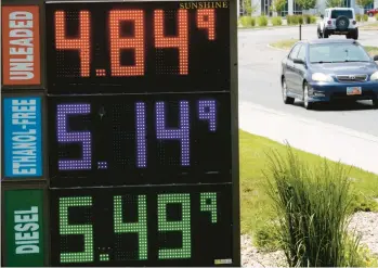  ?? RICK BOWMER/AP ?? Gasoline prices Thursday in Salt Lake City. The national average price on Friday was $4.99 per gallon.