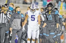  ?? Richard Shiro The Associated Press ?? Dax Milne (5) and Coastal Carolina’s Grayson McCall (10) after Milne was stopped short of the end zone on the final play.