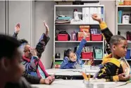  ?? Josie Norris/Staff photograph­er ?? First-grader Jenesis Saldana waits to ask a question at Essence Preparator­y Public School, a boutique charter school in San Antonio.