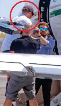  ??  ?? Departures: Harry and Meghan, carrying Archie, both circled, board the private jet, below