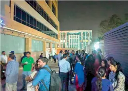  ??  ?? Shoppers rush out of the Manjeera Mall in Kukatpally, after they felt mild tremors on Tuesday evening.