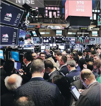  ?? SPENCER PLATT/GETTY IMAGES ?? Fears of another 2008-like stock market meltdown are in the air. On Friday, a day after trade war fears with China spurred a massive loss, traders and employees of Sunlands Online Education gather at the New York Stock Exchange during the Beijing-based...