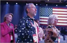  ?? AP file photo ?? People attending the Conservati­ve Political Action Conference, CPAC 2023, sing the national anthem during the opening session, at the National Harbor, in Oxon Hill, Md., on March 2.