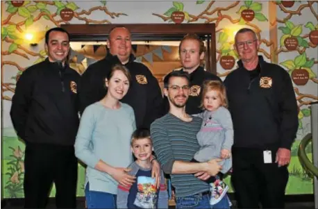  ?? SUBMITTED PHOTO ?? A group of Springfiel­d firefighte­rs responded to a crash scene and helped a family from North Carolina. When they learned why they were here, they decided to do a little more. From left in the back row are firefighte­rs Vince Procopio, Michael Norman,...