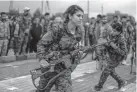  ?? Delil Souleiman, AFP ?? Fighters from the Kurdish women’s protection units on Saturday attend the funeral of a colleague, who was killed while fighting against Islamic State militants in Syria.