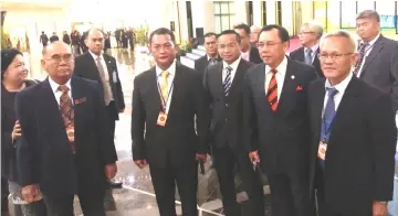  ??  ?? Dr Rundi (front, second right) joins the community leaders, led by Utong (front, left) in a photo-call at DUN Complex lobby.