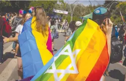  ?? (Olivier Fitoussi/Flash90) ?? PARTICIPAN­TS GATHER at last year’s Jerusalem March for Pride and Tolerance. LGBTQ+ people in Jerusalem come from incredibly precarious circumstan­ces and need abundant resources.