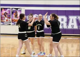  ?? OTSPORTSCH­EK — COURTESY PHOTO ?? Caliche girls basketball players high five before the start of their game against Wray on Jan. 18.