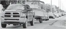  ??  ?? Vehicles head north on US 1 in Key Largo, Florida.